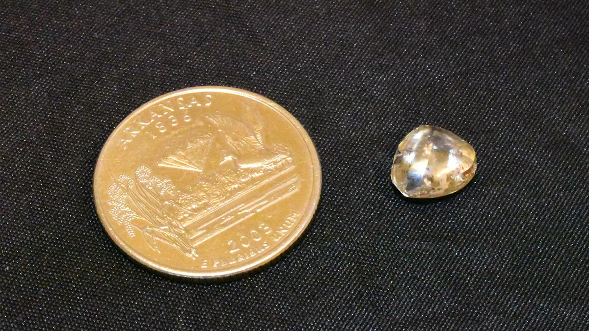 Smith's diamond next to coin