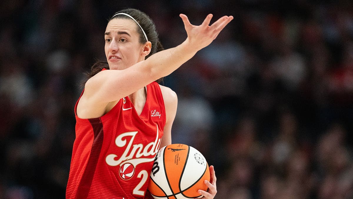 Caitlin Clark reacting during a WNBA game