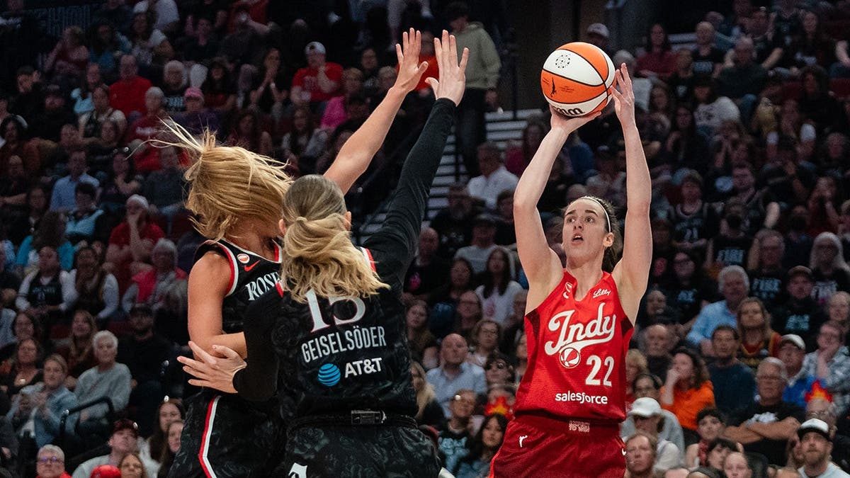 Caitlin Clark attempts a three-pointer