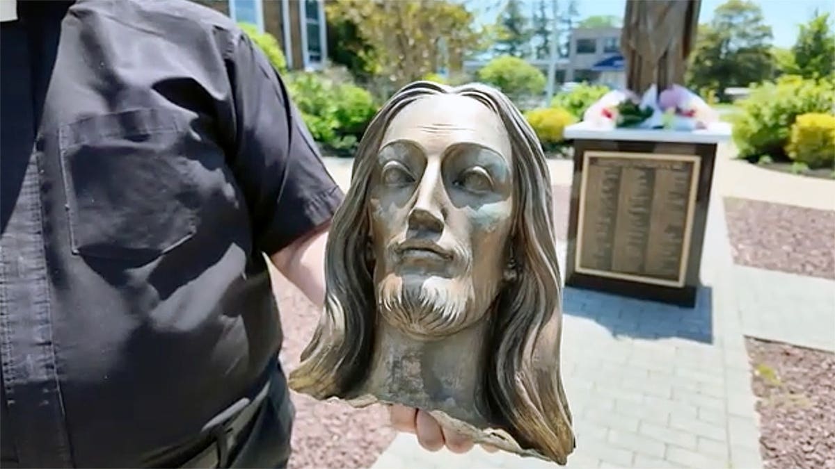 Severed Jesus statue head outside Long Island church.