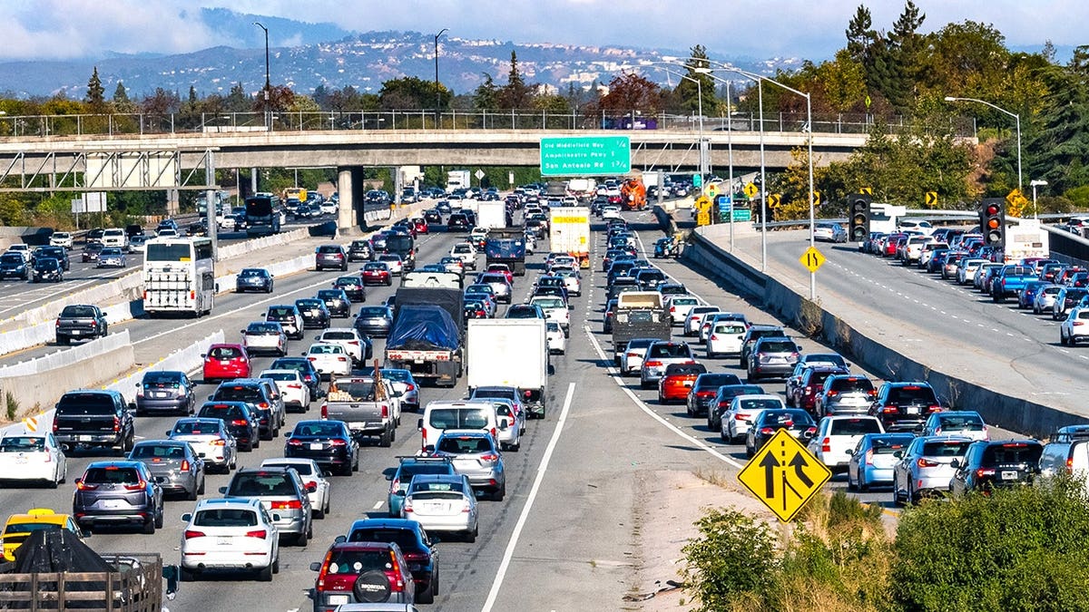 View of traffic on American highway with mountain in background