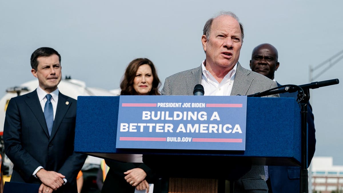 Mike Duggan at speech with Buttigieg and Whitmer