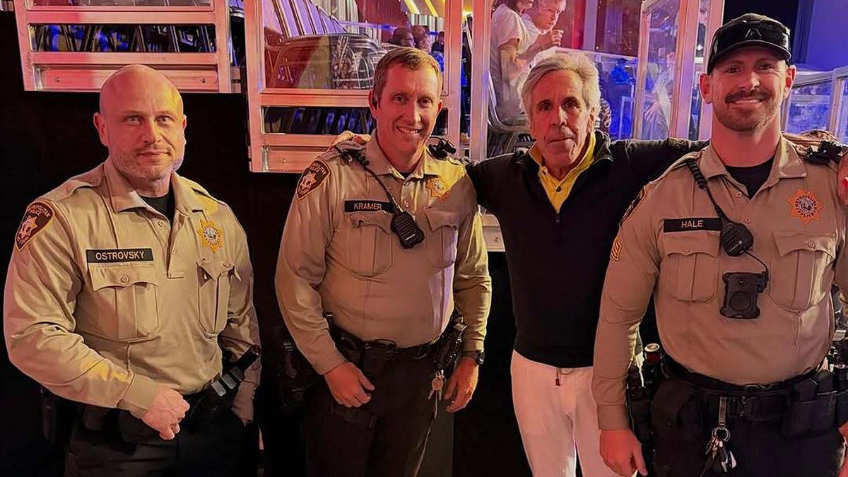 Palm Beach Pete poses with sheriff’s deputies in Palm Beach