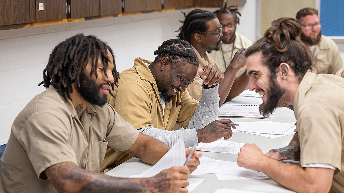 Inmates participating in faith-based ministry