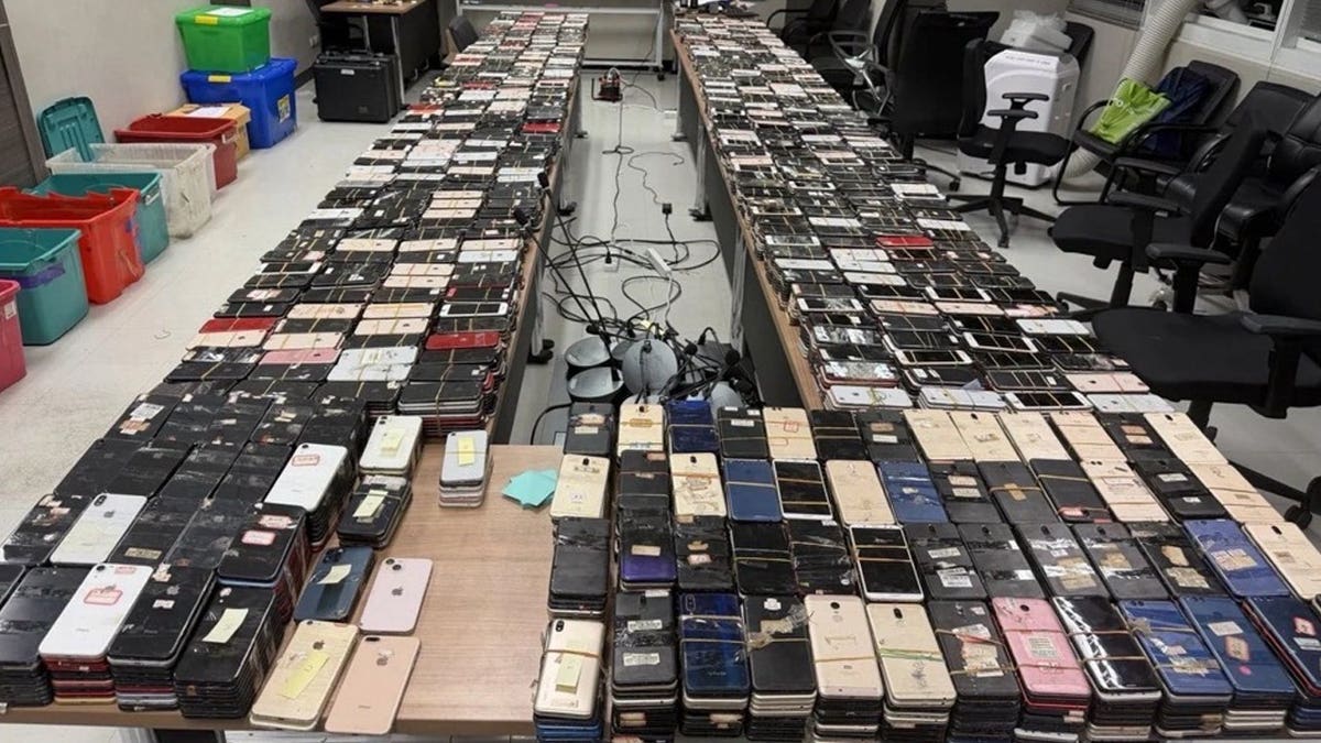 A ample fig of seized devices from an FBI anti-scam cognition successful Thailand.