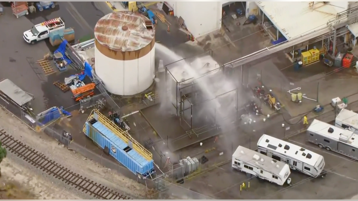 Fire officials said a ample chemic vessel was astatine hazard of spilling oregon exploding, perchance igniting adjacent chemic tanks.