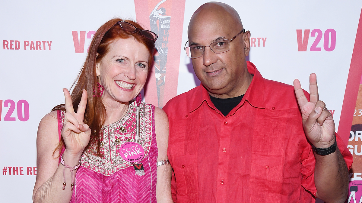 Jodie Evans and Neville Roy Singham standing together
