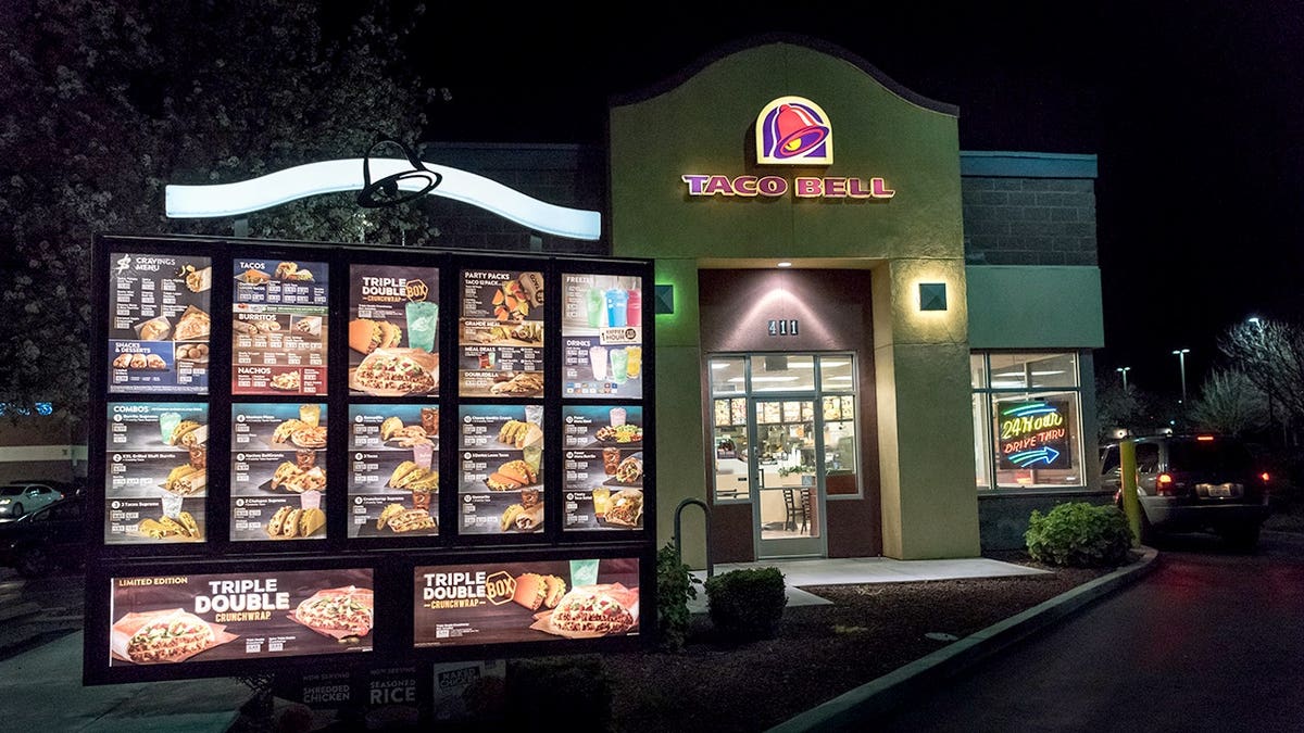 Taco Bell restaurant building illuminated at night in Woodland, California