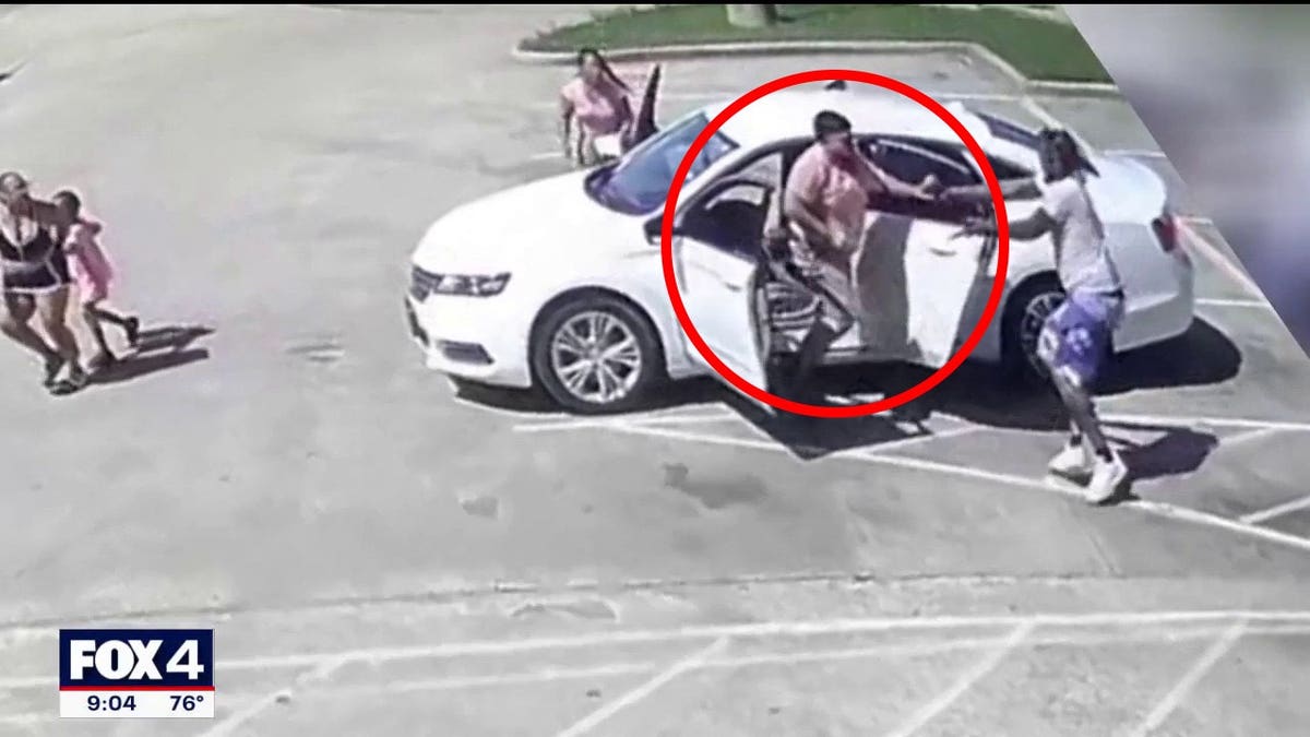 The suspect was seen trying to get into the car while physically fighting the father.