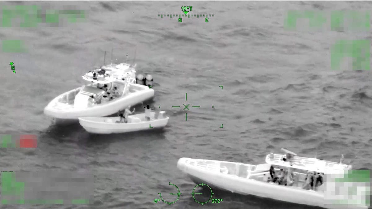 A pair of three boats are displayed in black and white