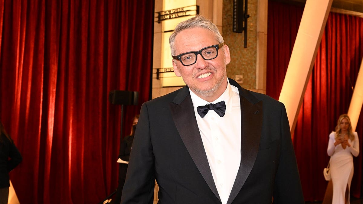 Filmmaker Adam McKay standing at the Dolby Theatre during the Academy Awards in Los Angeles
