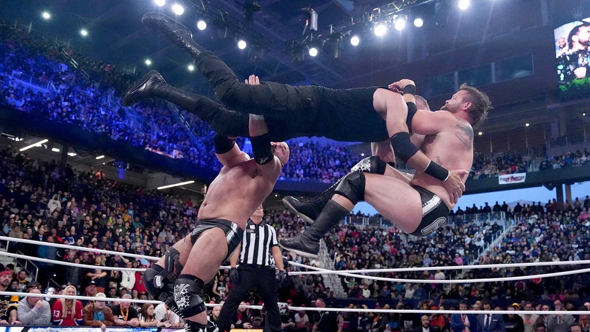FTR hits a Shatter Machine wrestling in AEW Double or Nothing event in Queens, New York