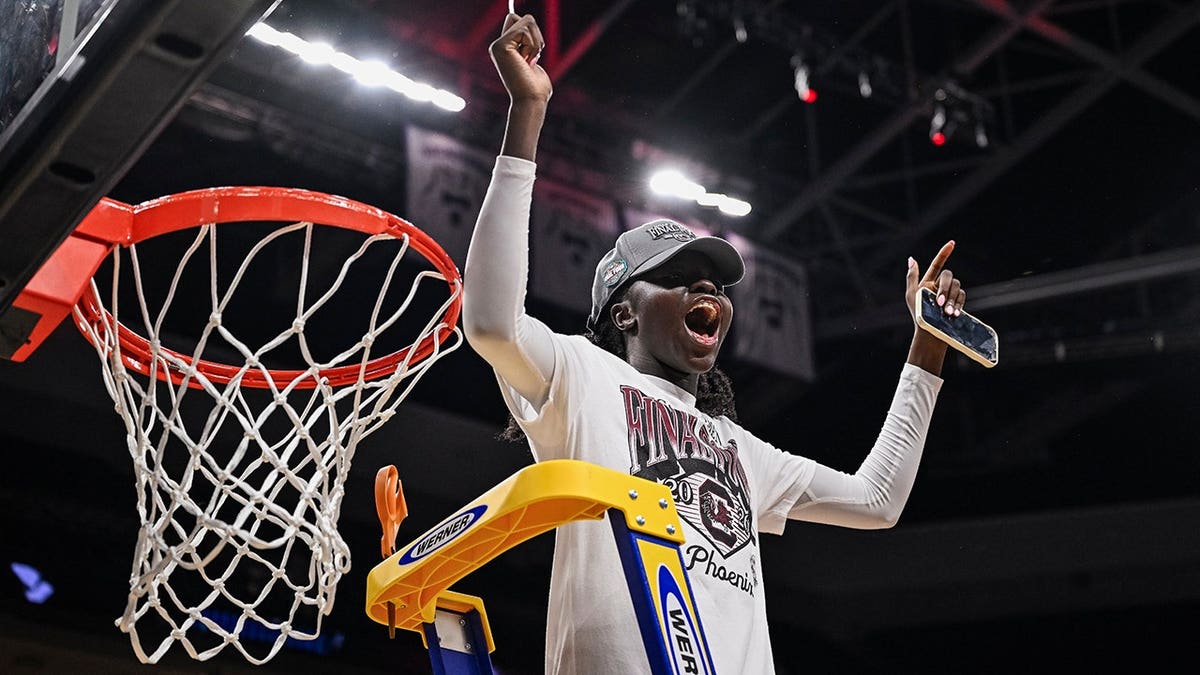South Carolina guard Agot Makeer celebrates after cutting into the net.