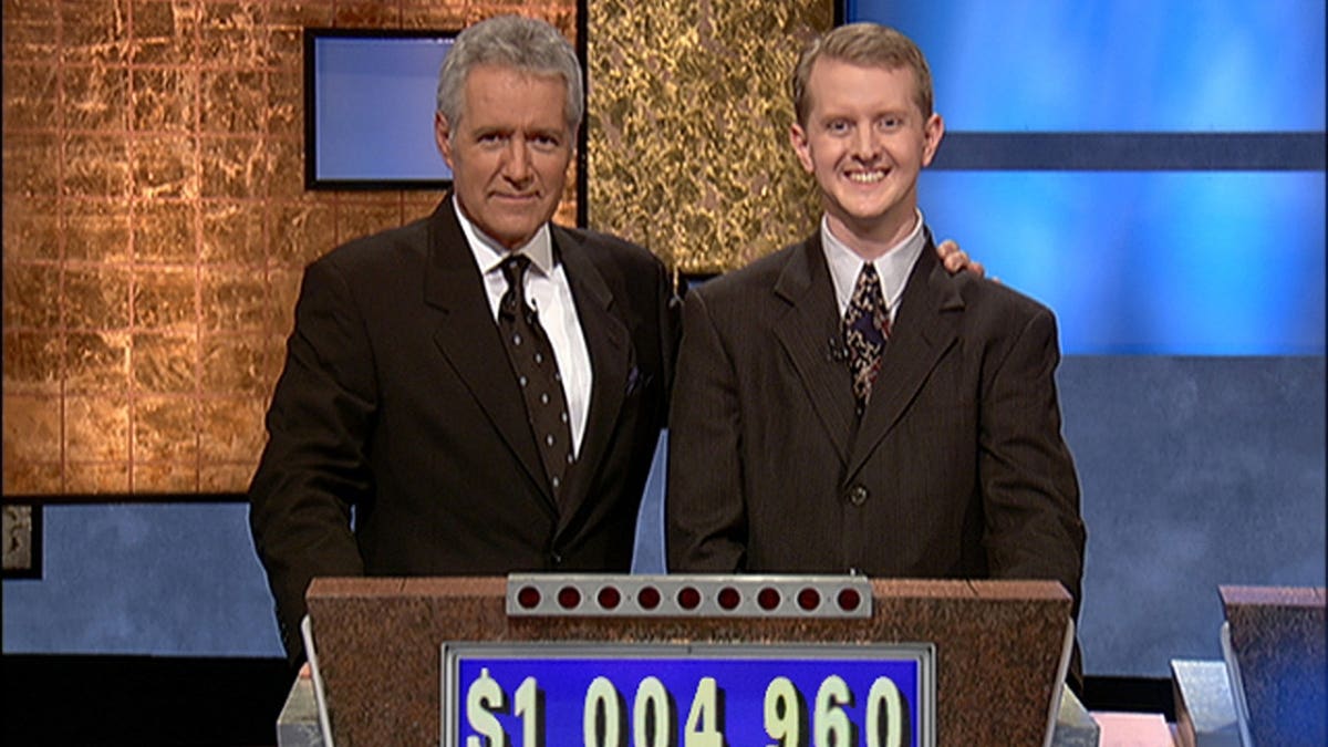 Jeopardy host Alex Trebek posing with contestant Ken Jennings in Culver City, California