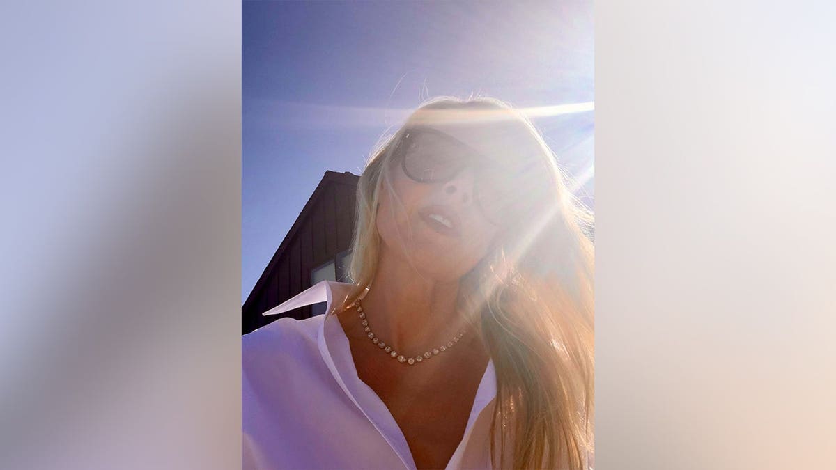 Ali Larter posing with the sun behind her in May 2026.