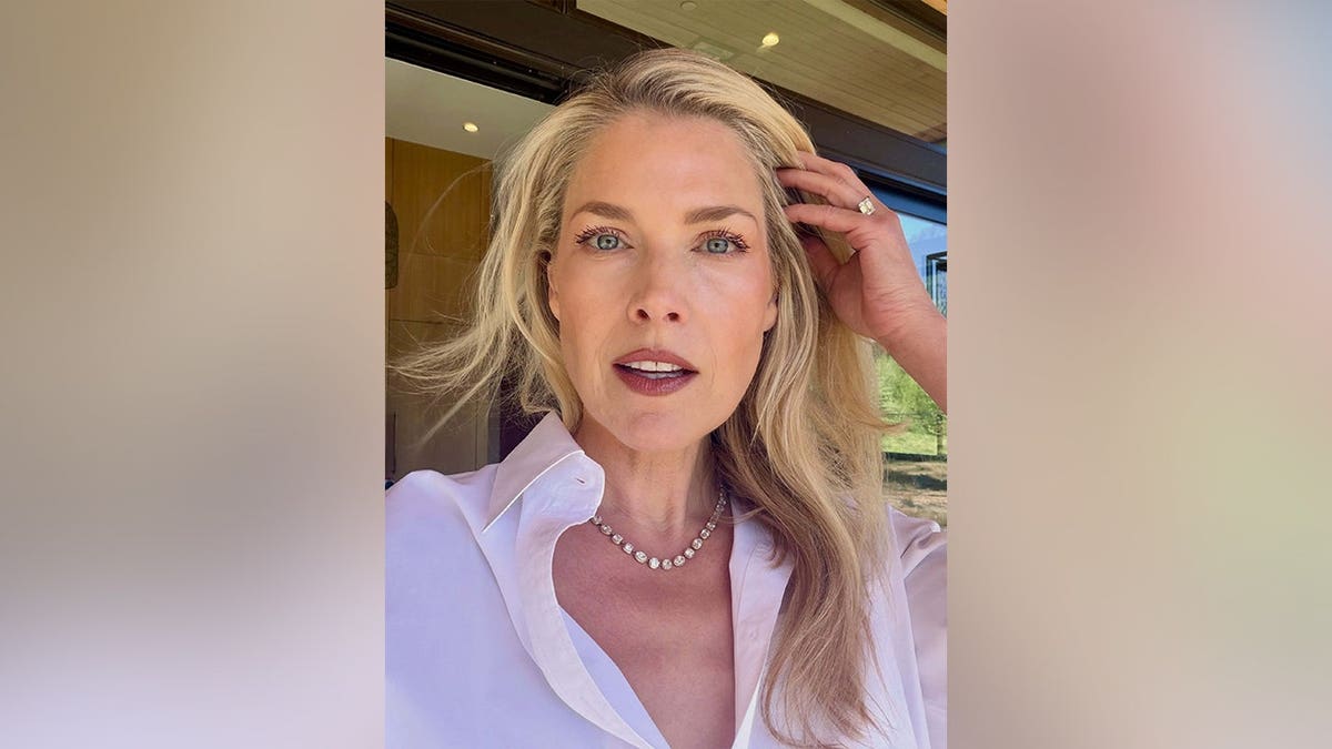 Ali Larter looking at the camera with her hand in her hair in May 2026.