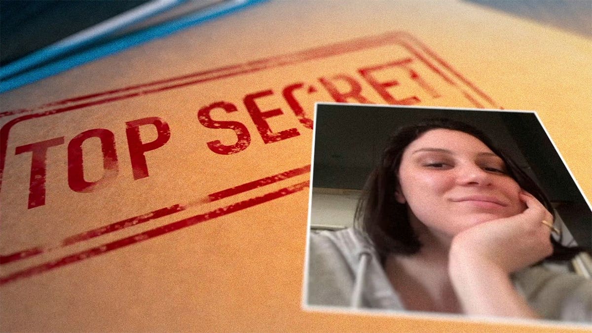 Amy Eskridge in front of a "top secret" file