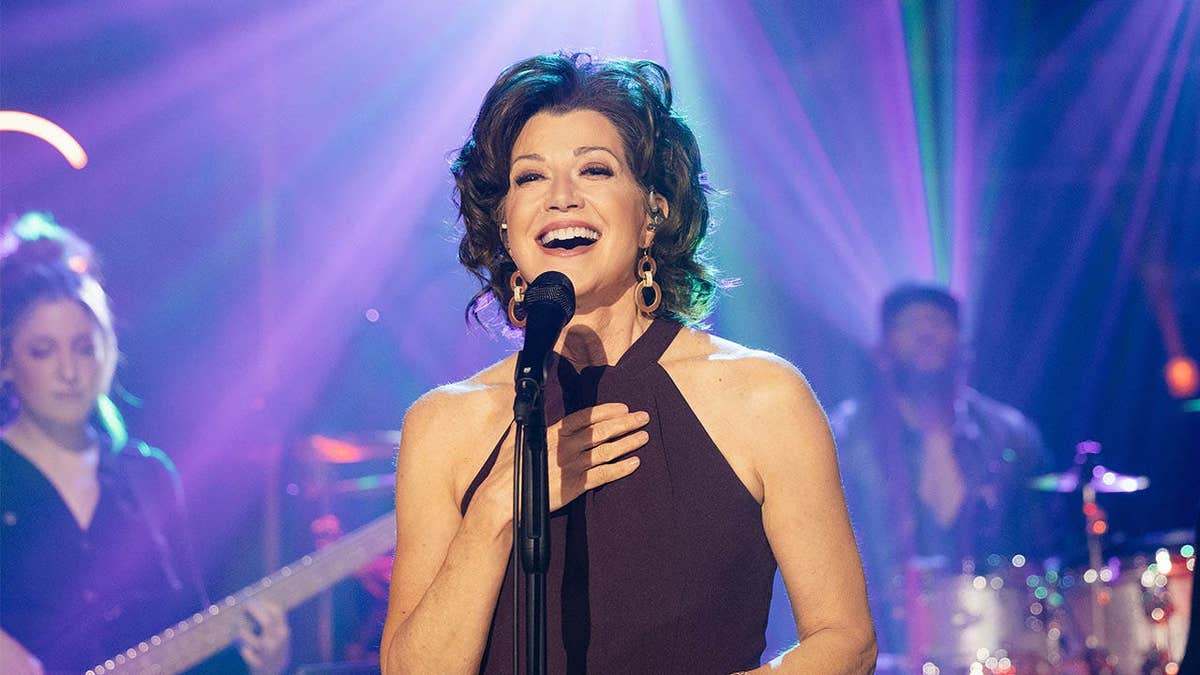 Amy Grant smiling and seated on The Kelly Clarkson Show set