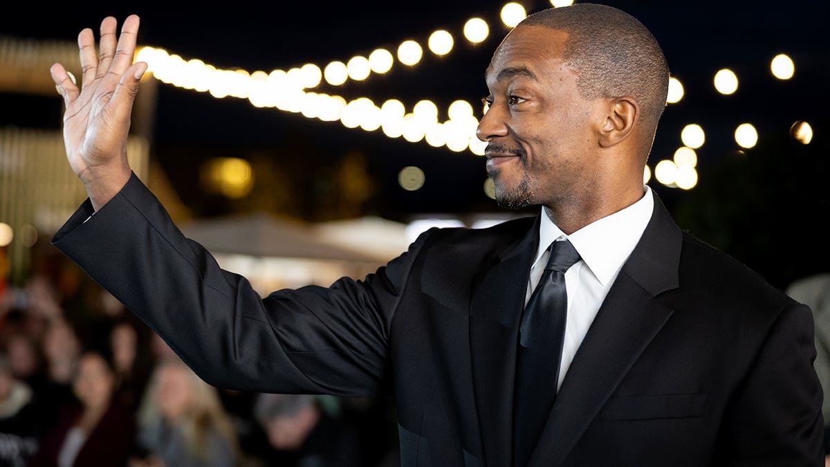 Anthony Mackie standing on the green carpet at the Zurich Film Festival.