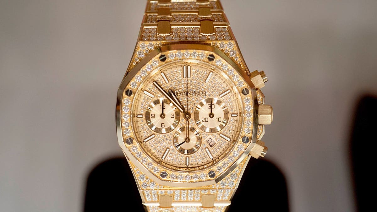 A gold Audemars Piguet luxury watch displayed at Christie's Palm Beach Luxury Show