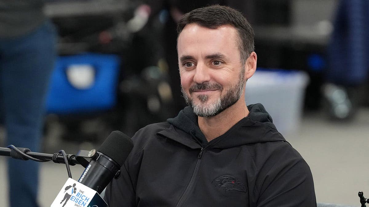 Baltimore Ravens coach Jesse Minter standing at the NFL Scouting Combine in Indianapolis