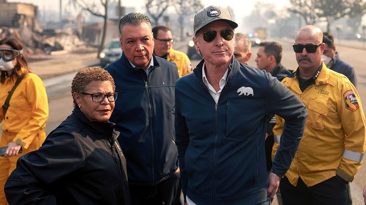 Gavin Newsom and Karen Bass tour Pacific Palisades during wildfire response.
