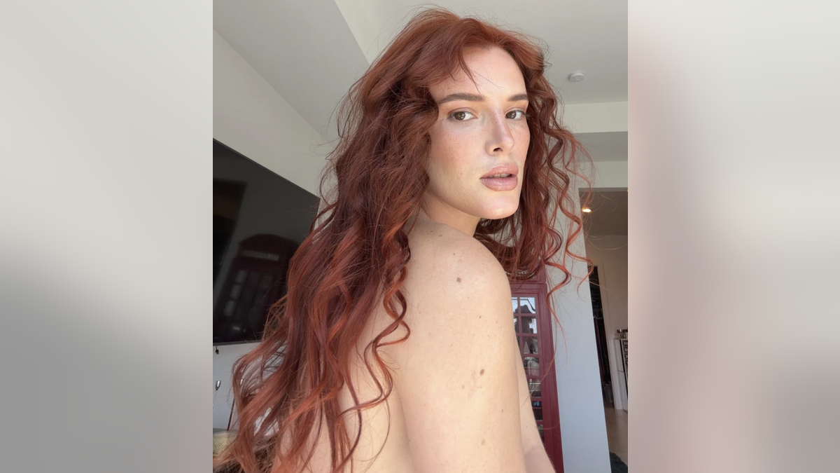 Bella Thorne turns to the side