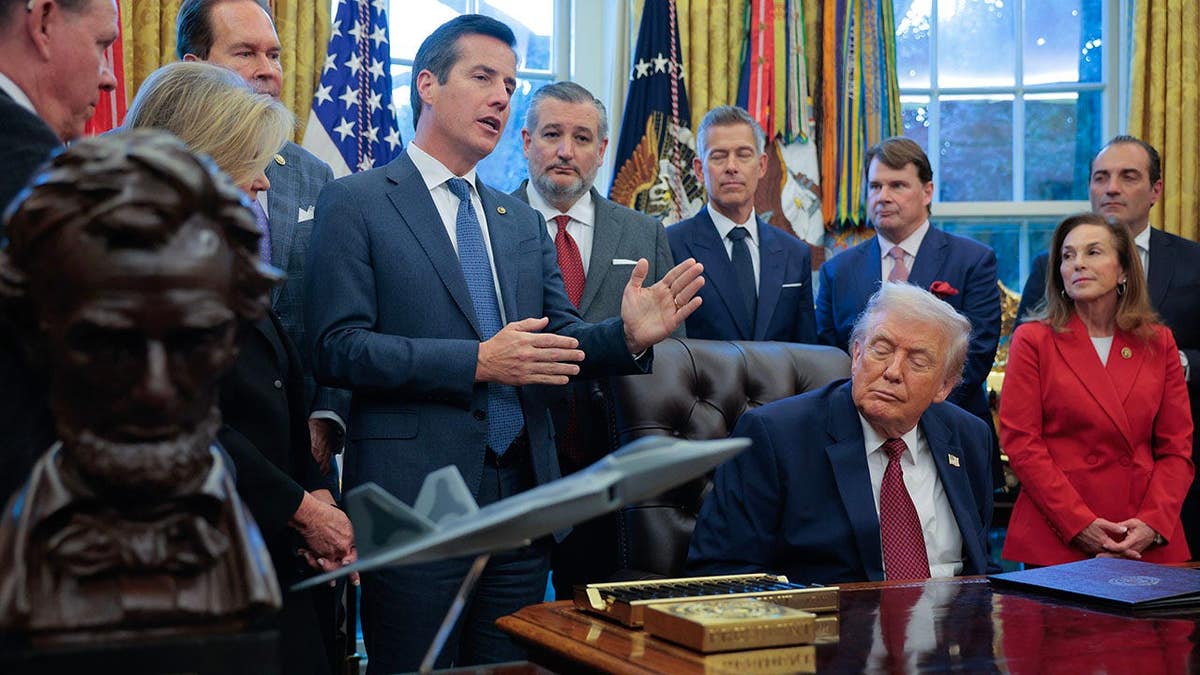 Sen. Bernie Moreno speaking in the Oval Office with President Donald Trump and others