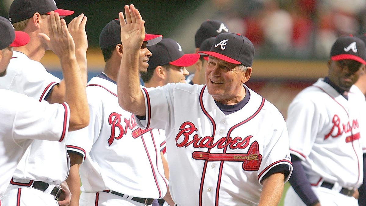 Manager Bobby Cox precocious   fives teammates astatine  Turner Field successful  Atlanta