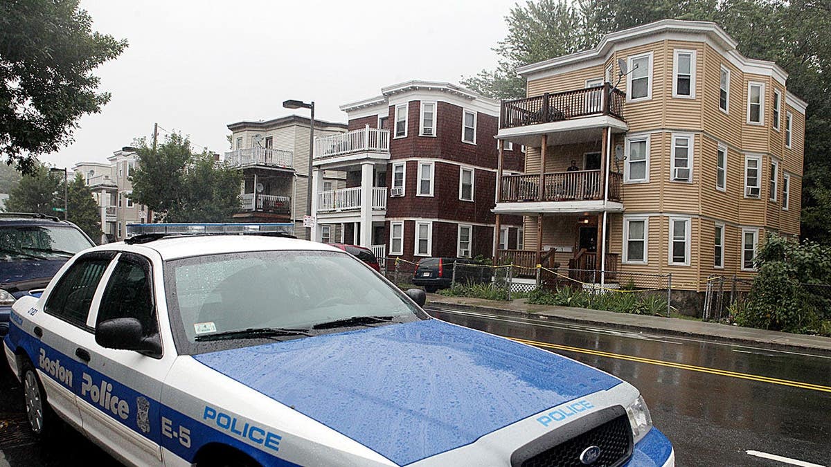 A Boston Police car parked across from 3964 Washington Street in Roslindale