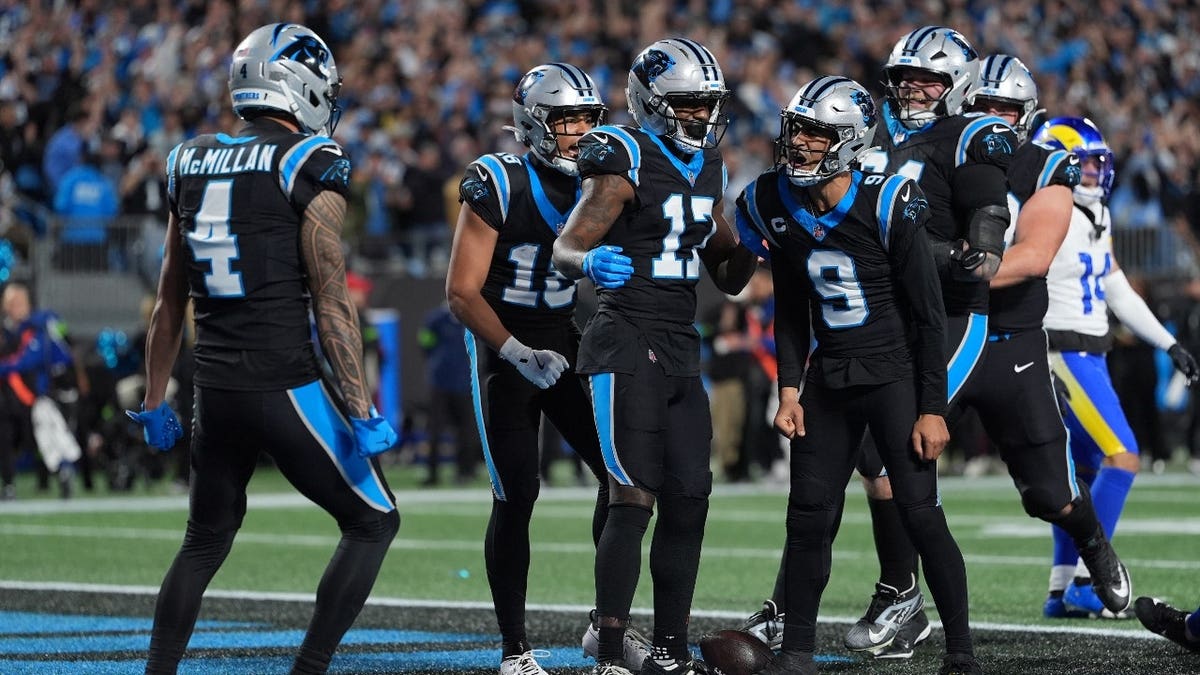 Carolina Panthers quarterback Bryce Young celebrating touchdown at Bank of America Stadium