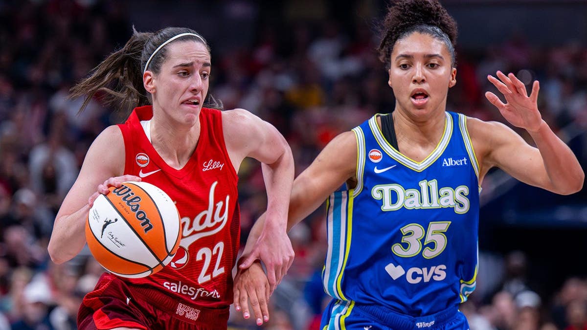 Indiana Fever guard Caitlin Clark driving ball past Dallas Wings guard Azzi Fudd