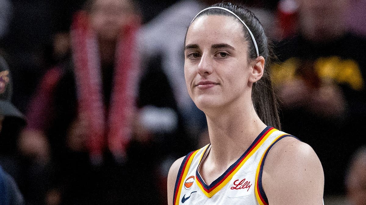 Indiana Fever guard Caitlin Clark standing on basketball court before game