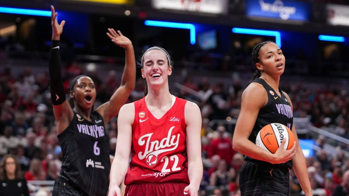 Indiana Fever SG Caitlin Clark smiles during a home game vs. Golden State Valkyries at Gainbridge Fieldhouse in Indianapolis.