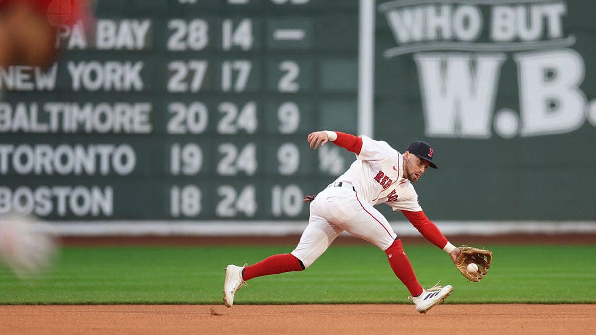 Caleb Durbin fields a ground ball at Fenway Park in Boston