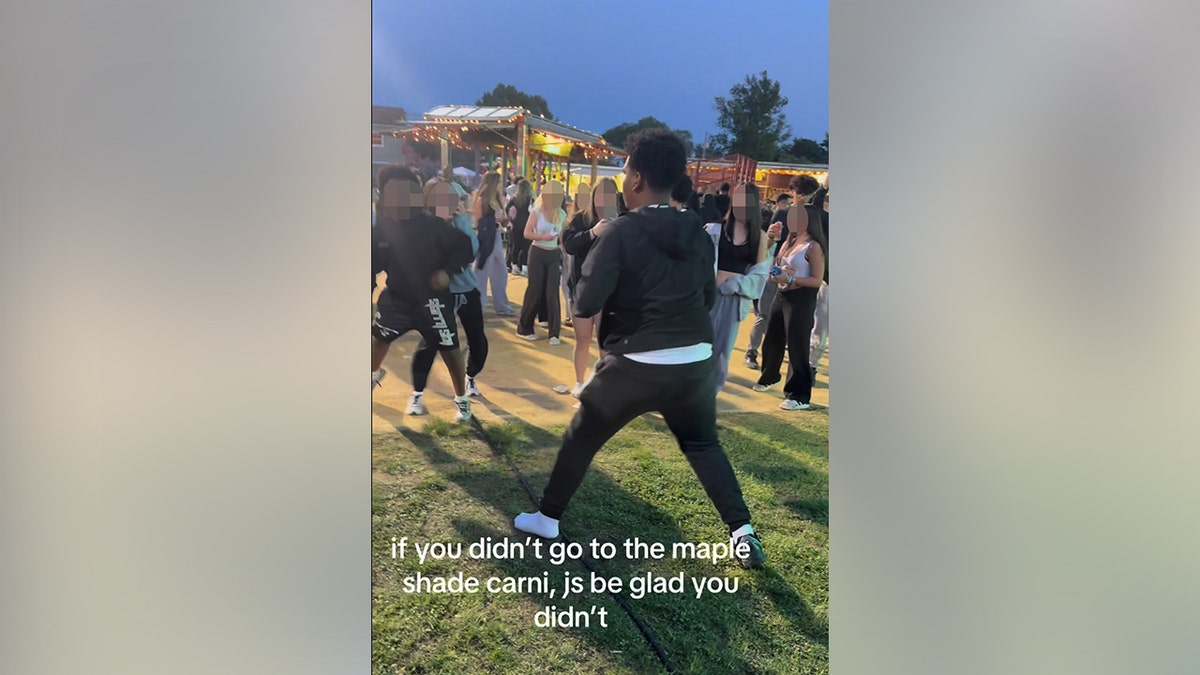 Two people seen at a carnival event