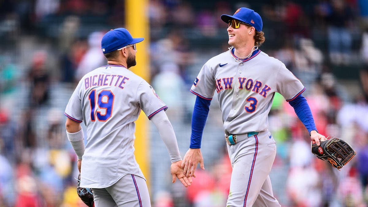 New York Mets right fielder Carson Benge greeting shortstop Bo Bichette at Angel Stadium