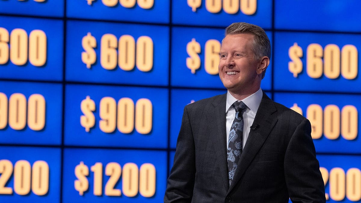 Mark Duplass smiling in front of a Jeopardy board