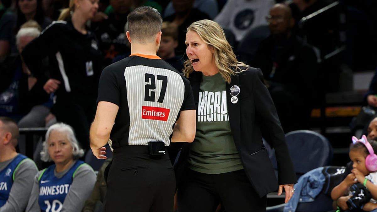 Head coach Cheryl Reeve shouting at referee Tyler Mirkovich during basketball game at Target Center