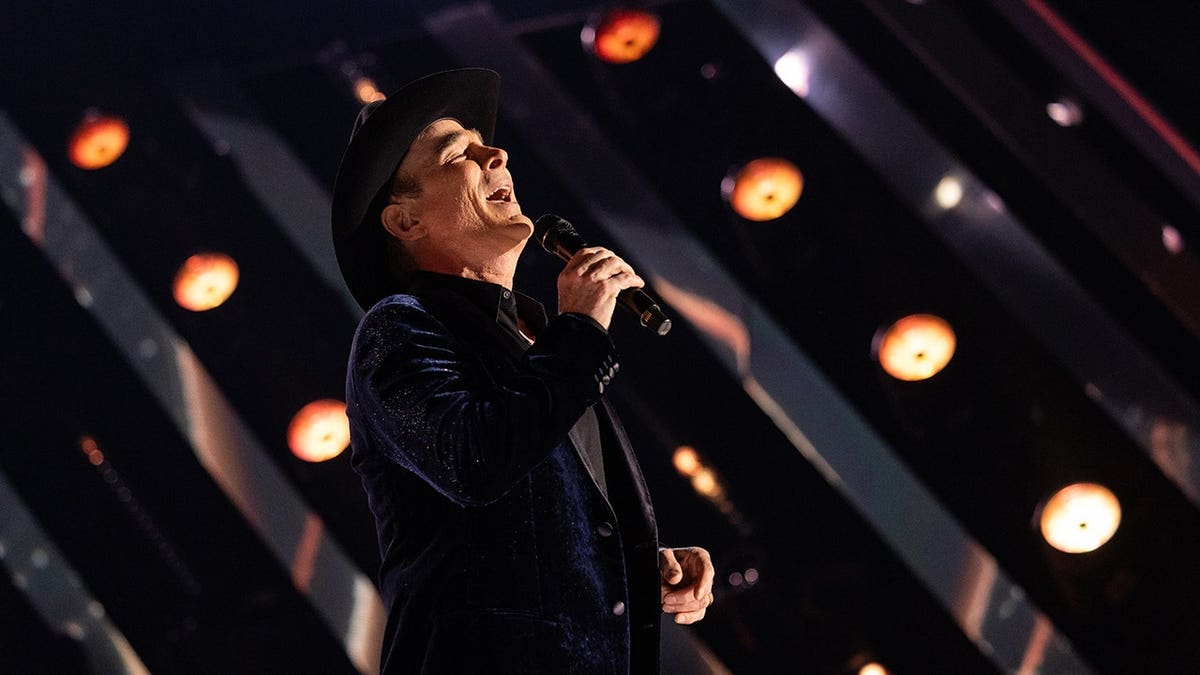 Clint Black performing onstage at the 60th Academy of Country Music Awards in Frisco, Texas.