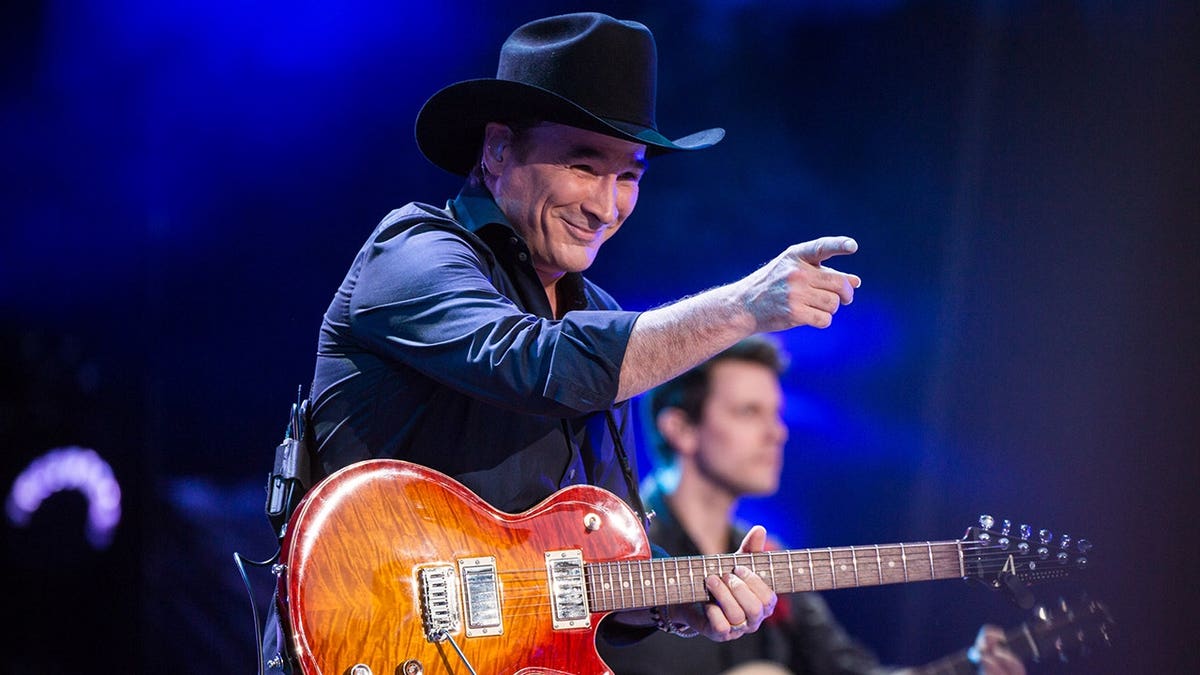 Clint Black performing on stage at Nissan Stadium in Nashville