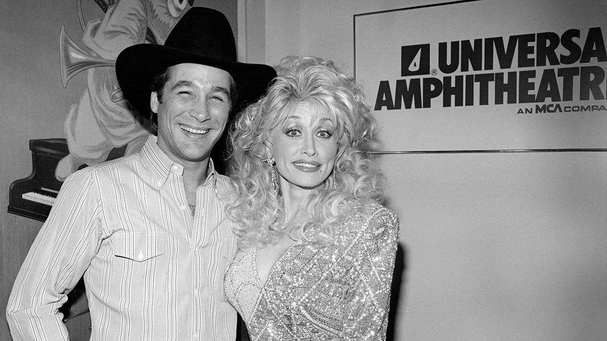 Clint Black and Dolly Parton posing for a portrait at Universal Amphitheatre