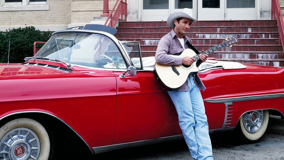 Country singer Clint Black standing at Houston Livestock Show and Rodeo