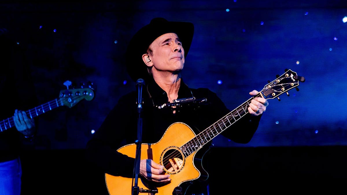 Clint Black performing on stage at the Winspear Centre in Edmonton