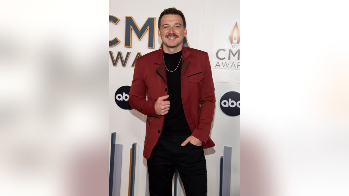Morgan Wallen standing on stage at the 57th Annual CMA Awards in Nashville