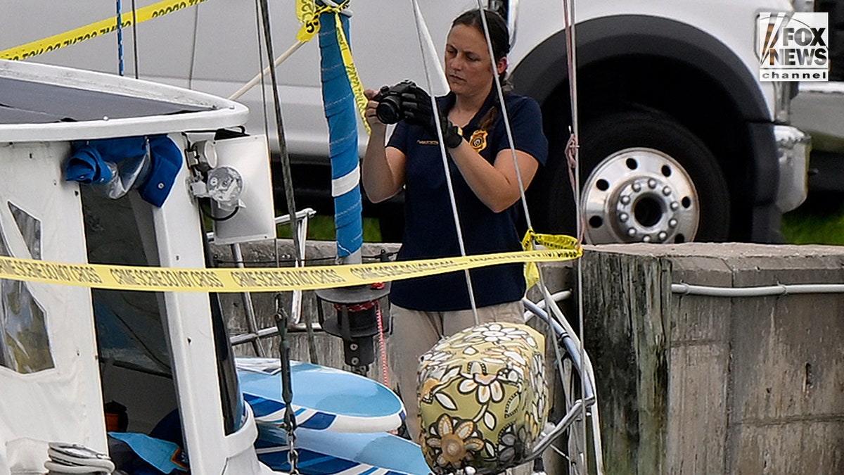 U.S. Coast Guard investigators search Brian Hooker's and his missing wife Lynette Hooker's the boat Soulmate.