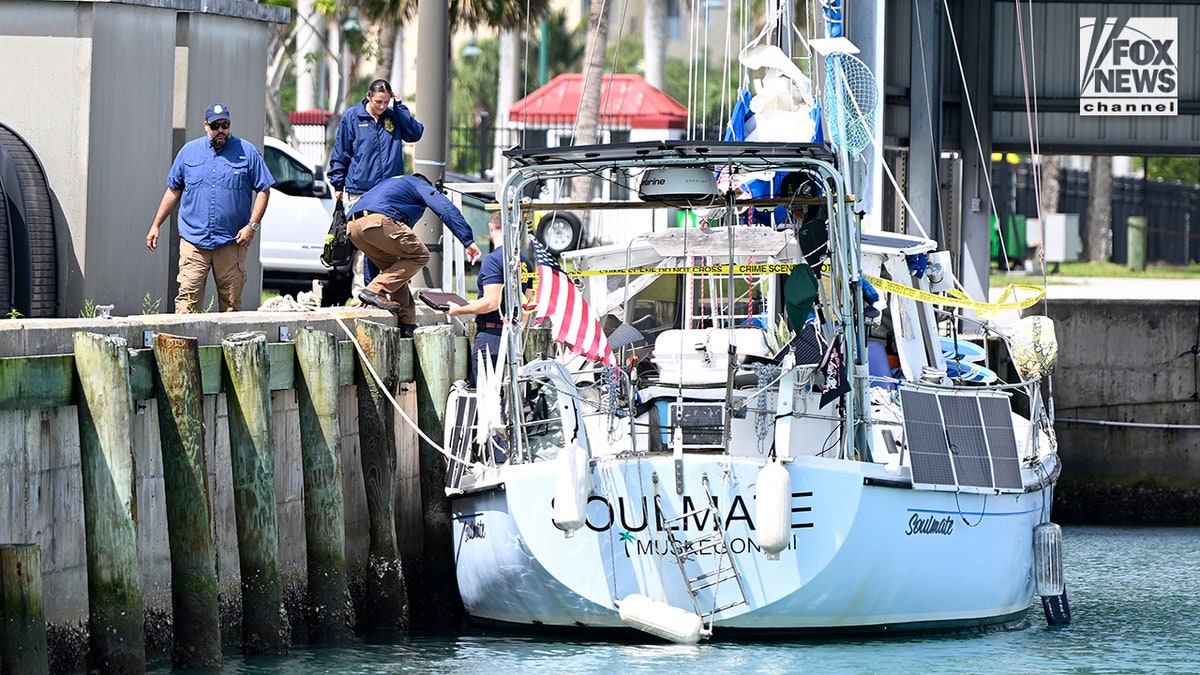 U.S. Coast Guard investigators search Brian Hooker's and his missing wife Lynette Hooker's the boat Soulmate.