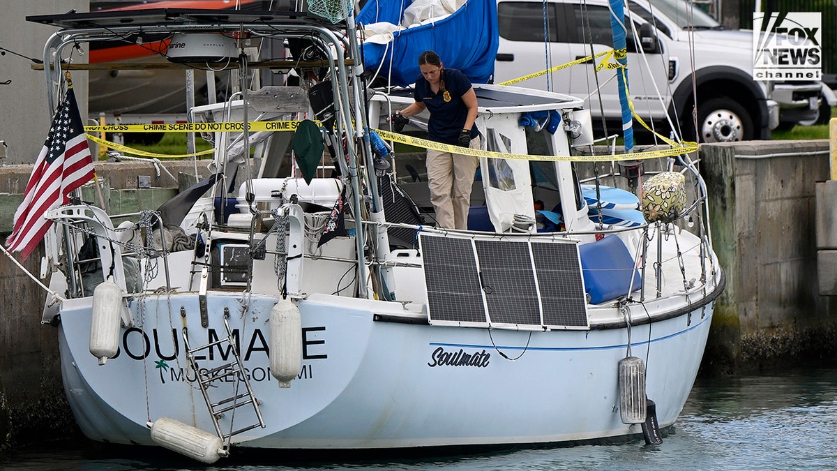 U.S. Coast Guard investigators searching the boat Soulmate docked at Fort Pierce station