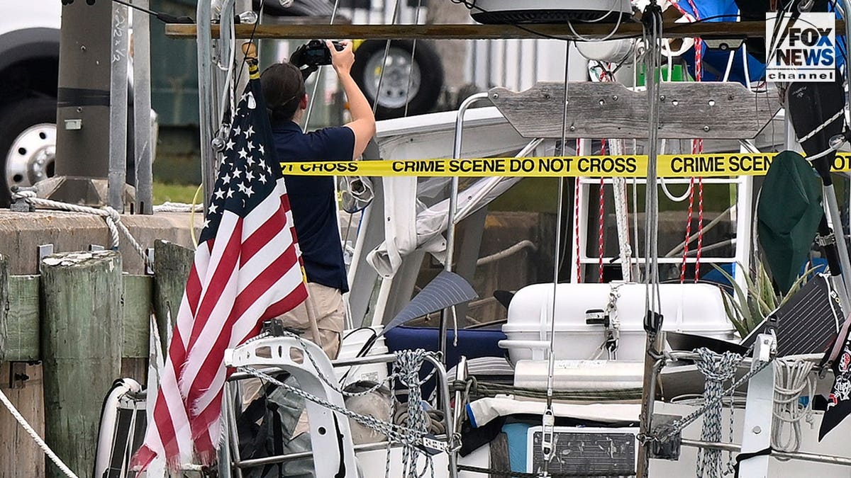 U.S. Coast Guard investigators search Brian Hooker's and his missing wife Lynette Hooker's the boat Soulmate.
