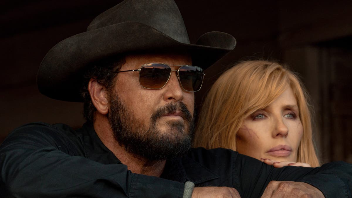 Cole Hauser as Rip Wheeler and Kelly Reilly as Beth Dutton standing in Dutton Ranch